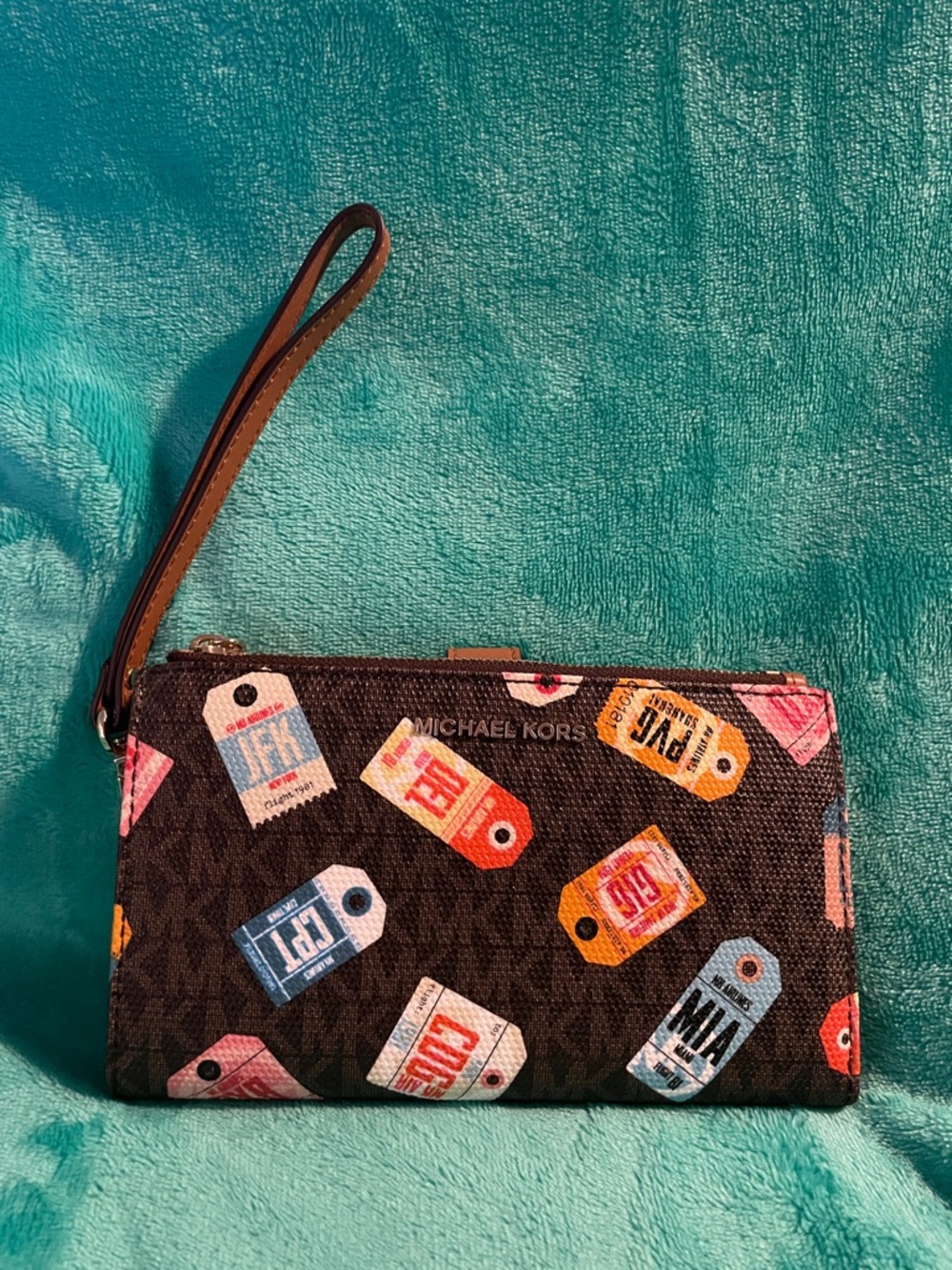 Michael Kors Brown Signature Wristlet with Multicolor Tag Print and Tan Strap